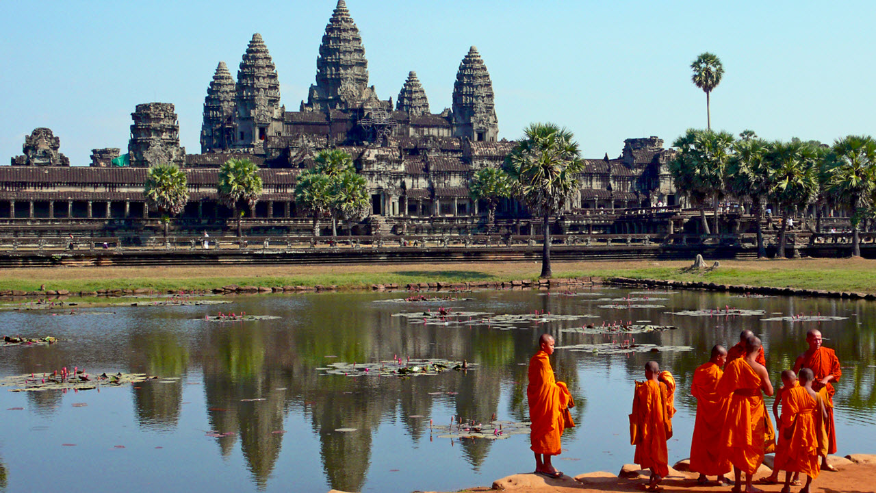Buddhist monks infront of Angkor Wat temple